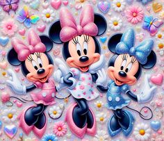 two mickey and minnie mouses are standing next to each other in front of flowers