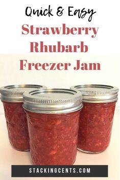 three jars filled with strawberry rhubar freezer jam on top of a table