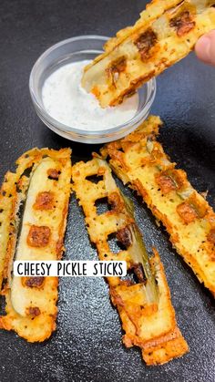 cheesy pickle sticks with dip in the middle