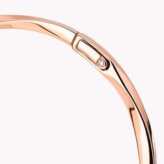 Sleek and stackable, this dynamic, twisting rose gold Spiral bangle performs playful pirouettes as it swirls elegantly around the wrist. Delicate enough to wear every day, wear it alone or pair with other Spiral bangles, amplifying the impact of these eternally modern jewels. The Spiral collection features delicate gold and pavé diamond jewels that are designed to be stacked and mixed and matched, alongside a range of captivating timepieces. A charming Spiral rose gold bangle featuring a total w Modern Rose Gold Bangle, Modern Rose Gold Round Bangle, Modern Twist Bangle With Polished Finish, Diamond Shaped Engagement Ring, Graff Diamonds, Rose Gold Bangle, Bangle Watches, The Spiral, Engagement Ring Shapes