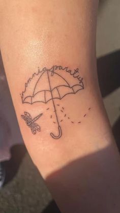 a small umbrella tattoo on the arm that says, i love you to the moon and back