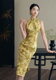 Fitted Sleeveless Ao Dai For Spring, Summer Formal Cheongsam With Stand Collar, Elegant Yellow Halter Neck Dress, Summer Party Cheongsam With Stand Collar, Yellow Fitted Ao Dai For Wedding, Yellow Fitted Halter Dress, Yellow Fitted Halter Neck Dress, Sleeveless Party Cheongsam, Luxury Fitted Summer Cheongsam