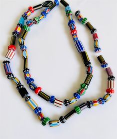 "You will receive: Artisan handcrafted assortment Ethnic African & Nepalese rare Glass beads. Mix Shapes, sizes & colors glass chevron beads. Very Unique, you'll love them! Sold by strand 15\" Approx 30+ beads by strand Random Size from : 8-15mm Approx hole from: 1-3mm Please select qty at drop box Contact me if you need larger quantity. *Please note these are hanmade beads, not close to perfect, they are unique and rare some are raw cut and unpolished*" Eclectic Multicolor Beads For Festival, Eclectic Multicolor Festival Beads, Artisan Multicolor Beaded Bracelet With Unique Variations, Artisan Multicolor Beaded Bracelets With Unique Variations, Eclectic Multicolor Beaded Necklaces With Large Beads, Eclectic Multicolor Beaded Necklace With Large Beads, Traditional Czech Glass Colorful Beads, Multicolor Polished Beads For Crafting, Multicolor Large Beads For Crafting