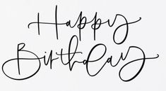 the words happy birthday written in cursive black ink on a white paper background