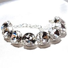 This oversized dynamic crystal bracelet is a Showstopper! 16 mm of faceted round diamond clear crystals will really light up your look! Amysfinery.etsy.com Clear Crystal Bracelet, Big Diamond, Clear Crystals, Statement Bracelet, Faceted Crystal, Crystal Bracelet, Magnetic Clasp, Diamond Crystal, Crystal Bracelets