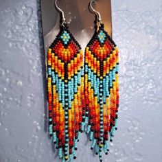 These handmade, bohemian vintage braided beaded tassel earrings are perfect for adding a unique touch to any outfit. Made from high-quality beads and durable copper ear needles for a comfortable fit. Designed in a vintage, boho style, suitable for daily wear and festival celebrations, including Mardi Gras. Every pair is handcrafted, making each one one-of-a-kind with slight variations. Vintage Boho Style, Boho Beads, Beaded Tassel Earrings, Earrings Colorful, Festival Celebration, Vacation Style, Beaded Tassels, Vintage Bohemian, Tassel Earrings