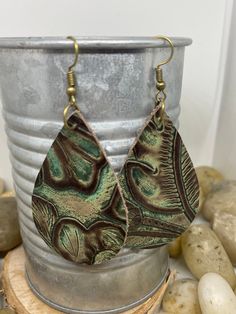 "Beautiful, genuine leather, mini teardrop earrings Aprox 1.5\" or large teardrop Aprox 2\" available in a variety of prints and patterns. These can be customized to hook color, available in bronze, gold, silver or black. Please message me immediately after ordering or will be sent as pictured. Options include: A-turquoise and brown paisley floral print with bronze hooks B-brown floral print with brown hooks C-red croc print with silver hooks D-turquoise weathered with black throughout and silve Artisan Hand-tooled Teardrop Earrings, Hand Tooled Teardrop Bohemian Earrings, Bohemian Hand Tooled Teardrop Earrings, Bohemian Teardrop Hand Tooled Earrings, Vintage Teardrop Patina Earrings, Unique Hand-tooled Teardrop Earrings, Hand Tooled Teardrop Earrings For Gift, Paisley Earrings, Burgundy Earrings