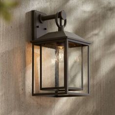 an outdoor light mounted on the side of a wall