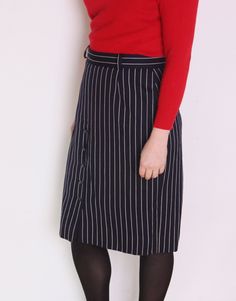 Beautiful vintage skirt made of pure wool. Long, midi high waisted cut. Navy blue color with pattern of white pinstripes. Zipper and button closure, belt loops. Row of buttons on the front. Lined. Era: 80's, Italy Fabric: 100% wool Condition: perfect, looks unworn Estimated size: L / XL (please, check the measurements) Measurements (measured flat): Waist: 42 cm / 16,5 inches Length: 68 cm / 26,7 inches Red turtleneck sweater available here: https://www.etsy.com/listing/214804600/80s-italian-red- Striped Midi Skirt For Work, Chic Pinstripe Skirt For Work, Pinstripe Vertical Stripes Skirt For Work, Striped Knee-length Skirt For Work, Fitted Pinstripe Skirt For Work, Pinstripe Skirt, Red Turtleneck Sweater, Skirt Plus Size, Long Midi