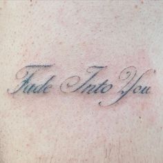 a close up of a person's chest with the words talk into you tattooed on it