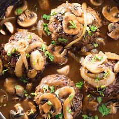 some meatballs and mushrooms are in a pot