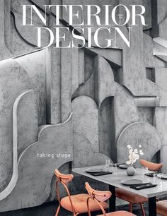 the cover of interior design magazine with two chairs and a table in front of it