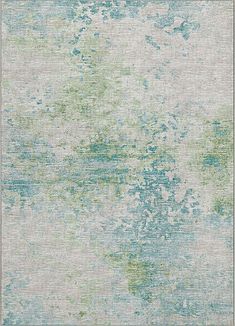 an area rug with blue, green and white paint on it's surface in the middle