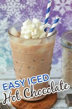 an easy iced hot chocolate drink in a glass with two blue and white striped straws