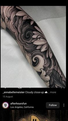 an image of a person's arm with tattoos on it