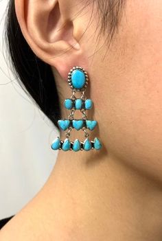 "Don't miss out on this brand new amazing high quality handcrafted sterling silver post dangle earrings with genuine Kingman Turquoise stones bezel set on solid 925 sterling silver. Our silver is genuine 925 sterling silver and stamped with 925. Earrings measures 1-5/8\" long and 1-1/8\" wide. You will receive the item in a gift box. Thanks for looking and check out more items in my Etsy shop for more great items and deals! https://www.etsy.com/shop/925usa Payment: We accept all major credit cards through direct check out and Paypal. New Mexico residents have to pay sales tax. Payments must be made within 3 days of purchase or the purchase will be canceled.  Shipping: SHIPPING IS FREE FOR ALL USA DOMESTIC SHIPMENTS! For USA domestic shipments, we use USPS First Class Mail with delivery con Turquoise Teardrop Chandelier Earrings In Sterling Silver, Turquoise Sterling Silver Chandelier Earrings, Turquoise Sterling Silver Dangle Chandelier Earrings, 925 Earrings, Silver Chandelier Earrings, Silver Chandelier, Cluster Bracelets, Turquoise Stones, Kingman Turquoise