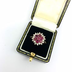 "Pretty ruby and diamond cluster ring set in 9ct gold.  Weighing 4.4grams in total.  Circa 2000.  U.K. size J 1/2 USA size 5 EU size 49 1/2  Please look carefully the photographs as we have taken care to capture any quirks or \"imperfections\" - all our items are commensurate with the age. Vintage and antique jewellery is unlikely to be absolutely perfect, but that's why it's so charming!  Our beautiful silver, gold and platinum rings can be resized for an additional cost - please see our \"Ring Resizing\" listing in our shop and read the description carefully.  Items come in a classic box or jewelry bag - boxes/props in images are for photography purposes only. If you'd prefer to receive the item without a box or bag, please let us know.  Returns are considered only if the item is faulty Vintage Diamond Bands, Gold Mary Janes, Turquoise Diamond Rings, Platinum Rings, Cluster Ring Set, J 1, Beautiful Rings Vintage, Gray Jewelry, Ruby Diamond Rings