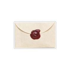 a white envelope with a wax seal on the front, and a red wax seal on the back