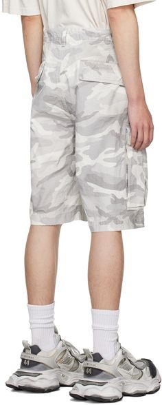 Oversized cotton ripstop shorts. Subtle distressing, smudging, and camouflage pattern throughout. · Belt loops · Drawstring at waistband · Four-pocket styling · Zip-fly · Cargo pocket at outseams · Logo embroidered at pocket Supplier color: Light grey Summer Combat Cotton Bottoms, Summer Combat Cargo Bottoms, Combat Cargo Style Bottoms For Summer, Summer Combat Cargo Style Bottoms, Combat Style Bottoms For Summer Streetwear, Combat Style Summer Cargo Pants With Pockets, Combat Style Cargo Pants With Pockets For Summer, Utility Camouflage Cotton Cargo Shorts, Cotton Combat Cargo Shorts