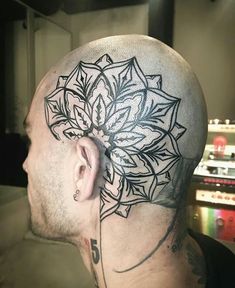 a man with a tattoo on his head