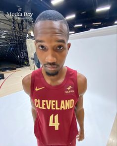 a man in a red jersey with the number four on it's chest and head