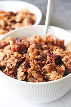 granola recipe in a white bowl with a spoon