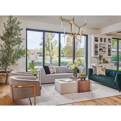 a living room filled with furniture and lots of windows