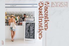 there is a woman standing at the counter in front of a restaurant with menus on it