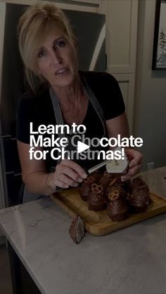 a woman cutting up some food on top of a wooden board with the words learn to make chocolate for christmas