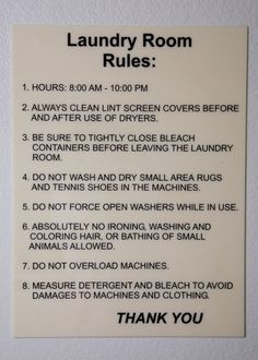 a sign on the wall that says laundry room rules