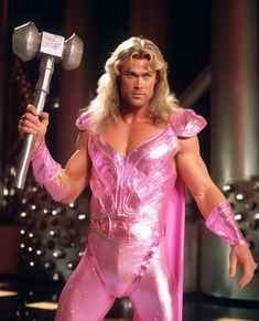 a man dressed in pink is holding a hammer