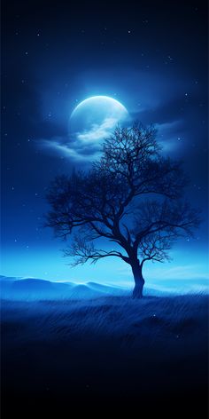 a tree in the middle of a field under a full moon