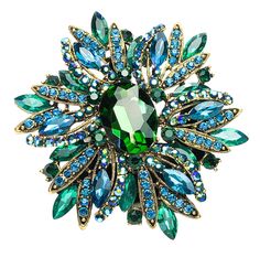 Looking for some bling to wear? This beautifully green/blue ring is guaranteed to finish off any Drag Queen look. The stones are set in a metal casing and with an elastic ring, it fits most hands. It measures 9.5cmx8cm Green Crystal Brooch Jewelry, Green Rhinestone Jewelry For Gift, Green Jeweled Brooch For Gift, Green Jeweled Brooches As Gift, Green Round Brooch Jewelry, Turquoise Party Ring, Green Round Brooch, Green Jeweled Brooch Gift, Green Brooch For Party