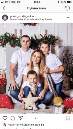 the family is posing for a christmas photo