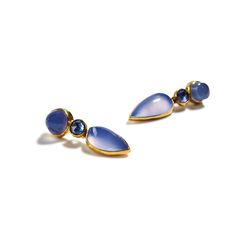 22k & 18K yellow gold, bezel-set cabochon chalcedony, bezel-set rose cut sapphire Across a deep plane of rich blue, the artists make a stunning statement for the ear as two bezel-set cabochon chalcedonies grace a bezel-set rose cut sapphire. Around their forms, the makers carefully endow their shape with high karat gold. As a brilliant work of art, it is nevertheless a comfort and near weightless fit once worn. These earrings gracefully swing from the ear, keeping the head of the work engaged. A Luxury Blue Jewelry With Bezel Setting, Blue Drop Jewelry With Cabochon, Blue Drop Cabochon Jewelry, Blue Cabochon Drop Jewelry, Blue Bezel Set Earrings For Formal Occasions, Jane Adams, Bezel Set Cabochon, Sapphire Cabochon, Chalcedony Earrings