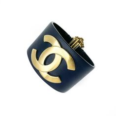 Chanel Navy Leather Brushed Gold Logo Cuff Bracelet 2017 For Sale at 1stDibs Modern Cuff Bracelet Bangle As Fashion Accessory, Modern Cuff Bracelet As Fashion Accessory, Designer Gold Leather Bracelet Adjustable, Designer Adjustable Gold Leather Bracelet, Designer Gold Adjustable Leather Bracelet, Luxury Cuff Bracelet, Luxury Cuff Bracelets, Chic Cuff Bracelet Fashion Accessory, Chic Cuff Bracelet As Fashion Accessory