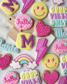 decorated cookies are arranged in the shape of letters