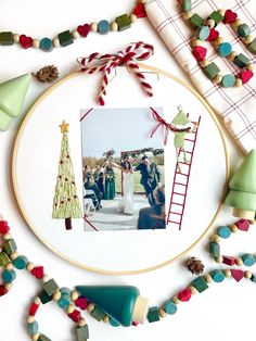 an embroidery project with christmas decorations and photos