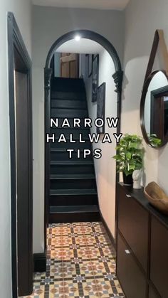 narrow hallway with tile flooring and wooden cabinets