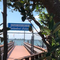 a wooden bridge with a sign on it that says enjoy your visit to golden star