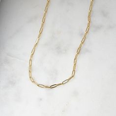 "Tiny links paperclip necklace! Our tiniest link paperclip chain available. Very sweet and dainty, and adds that perfect trendy touch while still being minimalist and chic! We have 4 different Paperclip styles available. See below for listings! ❖ DETAILS ❖ ➤ 14k Gold, Rhodium, or Rose Gold plated 925 Sterling Silver ➤ Made of THICK plating over sterling silver for a piece that will be with you for years to come! ➤ 16\" Chain + 2.5\" Extension chain ➤ Lobster Clasp Closure ➤ Nickel-free and hypoa Minimalist Gold Charm Necklaces With Paperclip Chain, Minimalist Gold Charm Necklace With Paperclip Chain, Dainty Paperclip Chain Necklace For Gift, Minimalist Link Chain Necklace For Everyday, Everyday Link Chain Necklace With Paperclip Chain, Minimalist Everyday Link Chain Necklace, Minimalist Paperclip Chain Necklace As Gift, Minimalist Paperclip Chain Necklace For Gift, Everyday Oval Link Charm Necklaces With Paperclip Chain