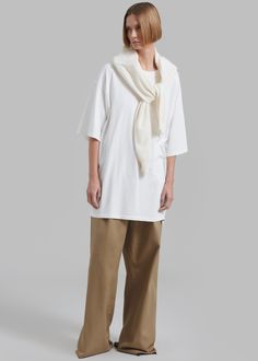 Color: White Midweight cotton jersey Oversized fit Crew neckline Drop shoulders Slip on style Unlined 100% Cotton Dry Clean Only By The Frankie Shop. Imported Casual White T-shirt For Layering, White Relaxed Tops For Fall, Relaxed White Tops For Fall, White Cotton T-shirt For Layering, Relaxed White Tops For Layering, Relaxed White Cotton Top, Off White Cotton Loungewear Tops, Off White Cotton Tops For Loungewear, Oversized White Tops For Everyday