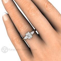 a woman's hand with a diamond ring on it