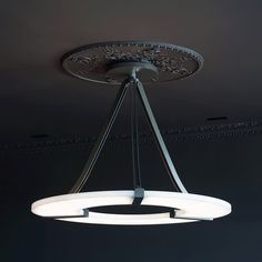 The Alabaster Halo Pendant Light is a perfect blend of modern elegance and timeless sophistication. Crafted from the highest quality alabaster, its semi-translucent beauty and natural texture is unique. It casts a warm, diffused light, creating a peaceful and luxurious atmosphere. The light is suspended from three slim black matt iron rods, seeming to float in the air, adding a contemporary and minimalist look to any space. Ideal for dining areas, living rooms, or entryways, the Alabaster Halo P Suspended Ceiling Lights, Wine Architecture, French Lighting, Entry Lighting, Light Highlights, Light Lamps, Suspended Ceiling, Lighting Pendant, Lights Ceiling