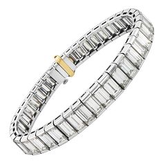 This bracelet features 38 carats of F-G VS graduated baguette cut diamonds set in platinum. This bracelet is made by the highest quality Italian craftsmans making it extremely flexible with soft delicate movements. Hidden clasp closure. 7 inch length. 53 grams total weight. Made in Italy. Viewings available in our NYC showroom by appointment. Tennis Wedding, White Gold Diamond Bracelet, Platinum Bracelet, Bracelet Tennis, Modern Bracelets, Anniversary Gift For Wife, Diamond Tennis Bracelet, Bracelets Gold Diamond, White Gold Bracelet