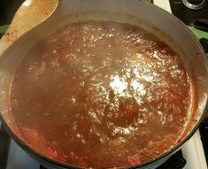 a pot on top of a stove filled with food