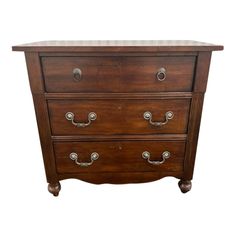 a wooden dresser with three drawers and marble top on it's sides, against a white background