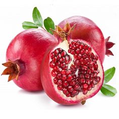 two pomegranates cut in half with leaves