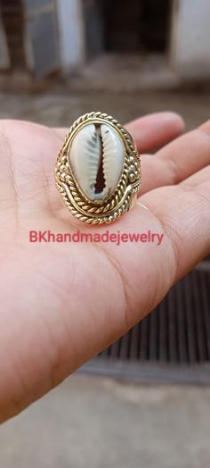 Cowrie Ring, Cowrie Shell Ring, Beach Shell Ring, Beach Cowrie Ring,Indian style Cowrie shell silver tone ring Handmade item Gemstone :-  Cowrie shell Merarial :- Brass, 925 Sterling Silver, Gold plated ,Rose Gold plated\ Style:- Boho & hippie This ring will definitely become one of your favorite piece-the ring makes a statement of its own. The ring was manufactured in India and part of a limited edition collection. For More Products Visit Mt Handmade Oval Jewelry For Beach, Handmade Open Ring Jewelry For Beach, Handmade Gold Rings For Beach, Handmade Gold Rings For The Beach, Cowrie Ring, Ring Indian, Shell Ring, Cowrie Shell, Christmas Birthday Gifts