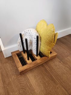 This glove or hat storage rack is the perfect way to dry your winter clothes off after a day in the snow. It sits over a floor vent and uses the heat from the house to dry off hats and gloves or mittens. There are six pegs for three pairs of gloves or two pairs of gloves and two hats. If you would like more storage, you can choose to add two pegs on each side of the rack for a total of 10 spots. The overall size is 13.5" x 8.5" x 8.75". The pegs are removable for easy storage and they can be put Glove Dryer, Floor Vent, Heat Vents, Women's Mittens, Floor Vents, Hat Storage, Snow Outfit, Clothes Hooks, Hat Rack